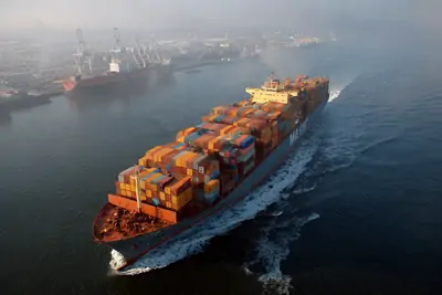 Ship fully loaded with containers just left the port.webp